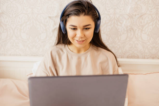 istock A girl studies or works remotely at home and home office 1396609516