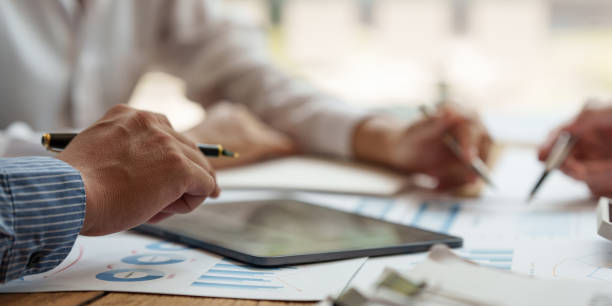 istock Business team hands at working with financial plan, meeting, discussion, brainstrom with tablet on office desk, Meeting concept. 1396611842