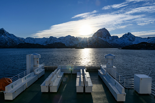 View from a ferry on the Lofoten islands in Northern Norway during a beautiful winter day.