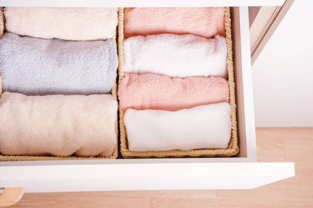 istock Folded towels in closet close-up, space organization concept. 1396615085