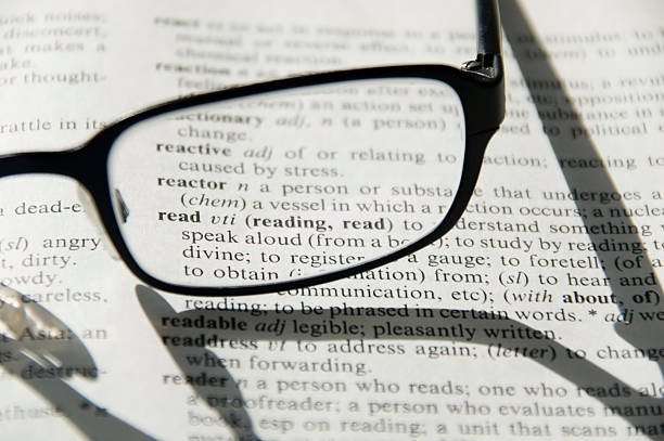 Glasses on dictionary, detail stock photo