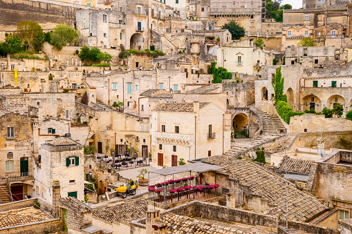 The stunning maze of alleys, stairs and stone houses in the old town of Matera, in southern Italy, known worldwide as the 'Sassi di Matera' (Sassi di Matera). The ancient city of Matera, in the region of Basilicata, is one of the oldest urban settlements in the world, with a human presence that dates back to more than 9,000 years ago, in the Paleolithic period. The Matera settlement stands on two rocky limestone hills called 'Sassi' (Sasso Caveoso and Sasso Barisano), where the first human communities lived in the caves of the area. The rock cavities have served over the centuries as a primitive dwelling, foundations and material for the construction of houses, roads and beautiful churches, making Matera a unique city in the world. In 1993 the Sassi of Matera were declared a World Heritage Site by Unesco. Image in High Definition format.