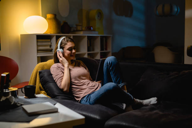 istock woman relaxing at home 1396618271