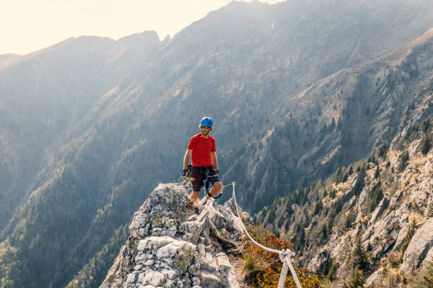 istock Man rock climbing on a Via Ferrata route 1396619659
