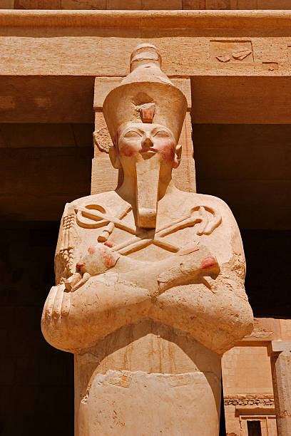 Queen Hatshepsut as Osiris Statue of Queen Hatshepsut, the female Pharaoh, as Osiris in her temple on the west bank of the Nile at Luxor (Thebes) temple of hatshepsut photos stock pictures, royalty-free photos & images