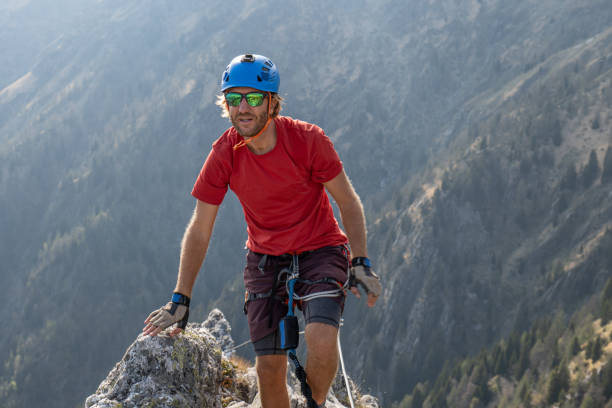 istock Man rock climbing on a Via Ferrata route 1396620239