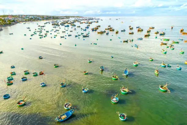 Mui Ne fishing village seen from above with hundreds of boats anchored to avoid storms, this is a beautiful bay in central Vietnam