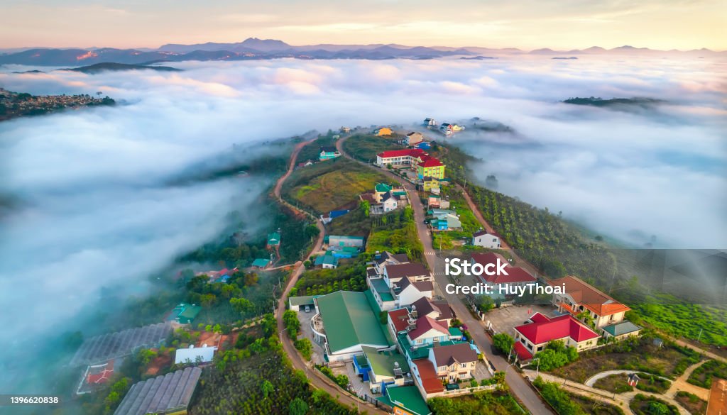Aerial view of the town in the early morning mist Aerial view of the town in the early morning mist is beautiful in the highlands of Da Lat, Vietnam Dalat Stock Photo