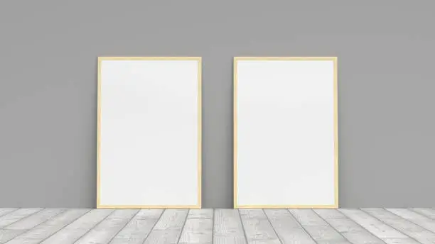 Mock up of two vertical woodenframes on the floor with gray wall. 3d render