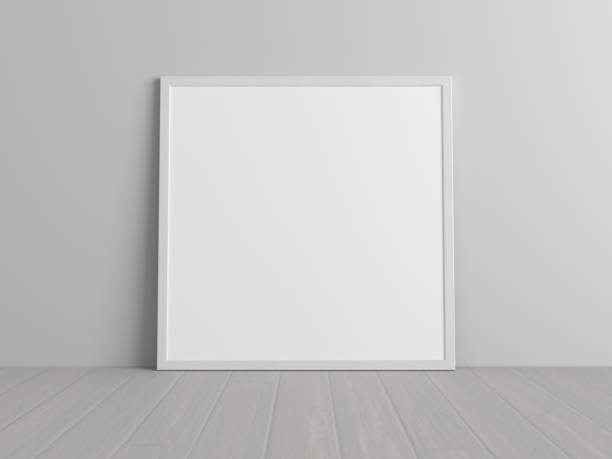 istock Mock up of square white frame on the floor with white wall. 1396621043