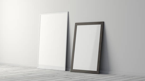 istock Mock up white and black vertical frames on the white floor with white wall. 1396621670