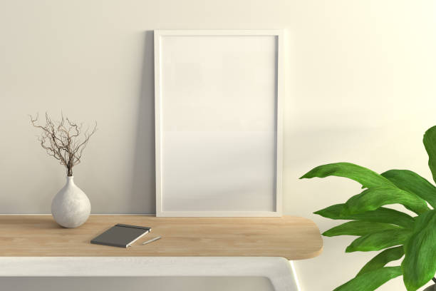 istock Vertical white frame mock up on wooden desk. 1396621715