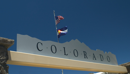 Colorado sign with state and US flag