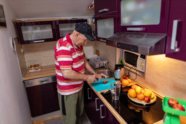 istock Portrait of a mature man preparing fruit smoothie 1396624548