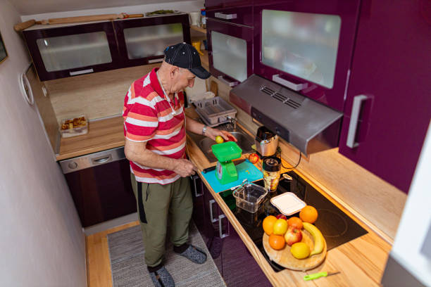 istock Senior man making food 1396624583