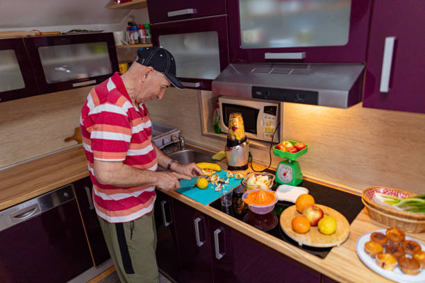istock Senior man preparing vegan meal 1396624739