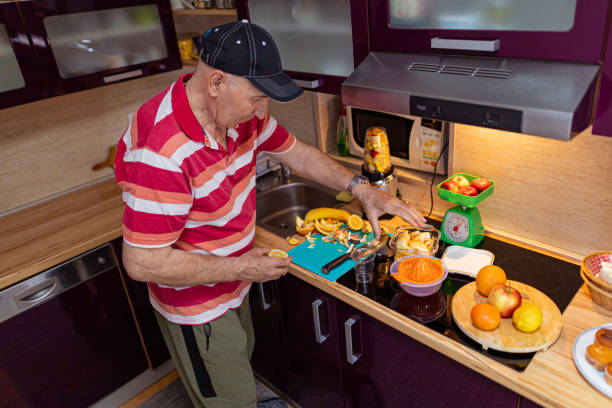 istock Senior vegan man preparing food 1396624752