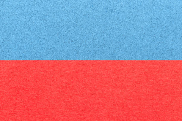 istock Texture of craft light blue and red paper background, half two colors, macro. Structure of vintage craft cardboard. 1396625915