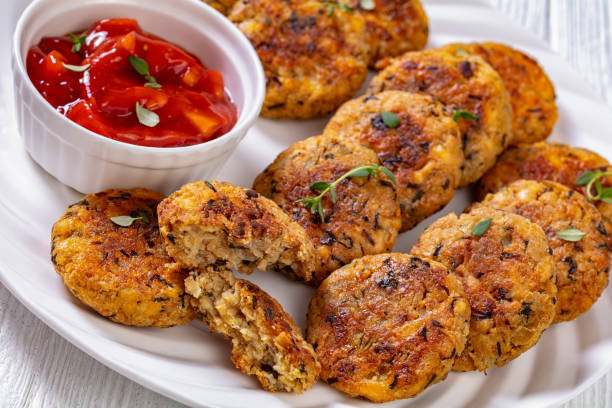 istock cauliflower patties on plate with tomato sauce 1396627370