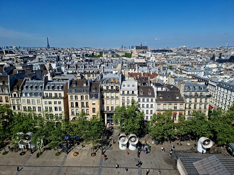 The wonderful Skyline of Paris City seen from the top of the Centre Georges Pompidou. The image was captured during a warm and sunny day in springtime