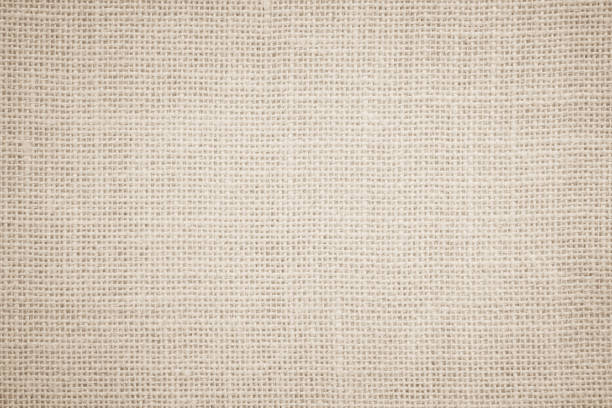 istock Jute hessian sackcloth burlap canvas woven texture background pattern in light beige cream brown color blank. Natural weaving fiber linen and cotton cloth texture as clean empty for decoration. 1396631869