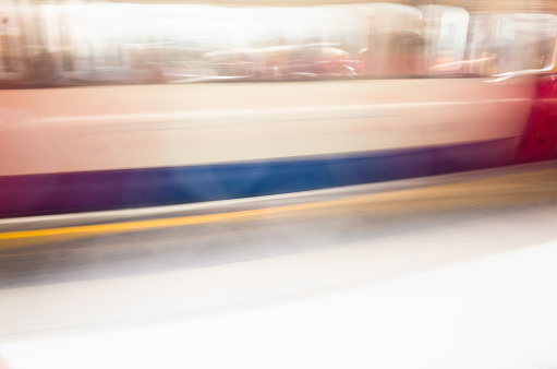 Travel by train - on the London Underground, or Tube - long exposure abstract background image.