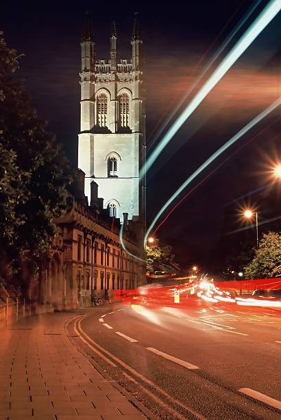 Oxford by Night Magdalen tower and bridge, Oxford, by night, floodlit tower with traffic trails in foreground oxford michigan photos stock pictures, royalty-free photos & images