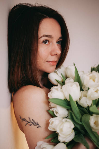 istock A beautiiful woman with tulip flowers 1396642092