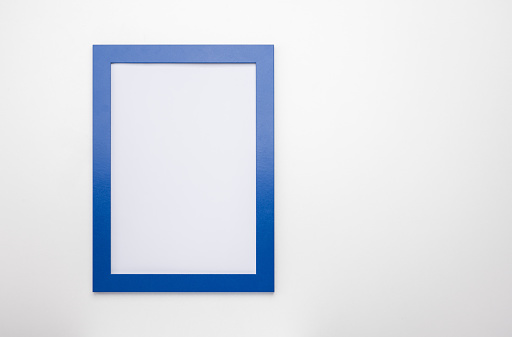 upright photo frame mockup on white wall. blank diploma frame on white wall background. Picture frame mockup. blank diploma frame on white wall background. Size 50x70, 20x28, a3, a4, copy space