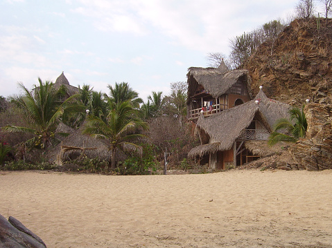 Bungalows on playa Zipolite, a popular tourist destination on the coast of Oaxaca state, Mexico.