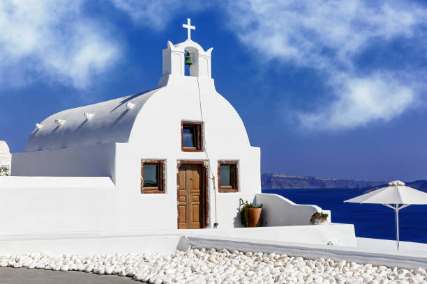 istock White church in Oia, Santorini, Greece. 1396644446