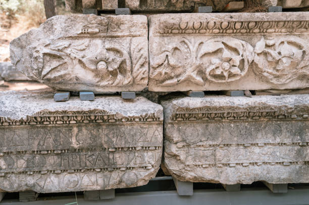 istock ruined construction of the old stone building with inscriptions in the ancient language. explore the ancient excavations of the ruins of the ancient Lycian city of Phaselis in Turkey in summer outdoor 1396644477