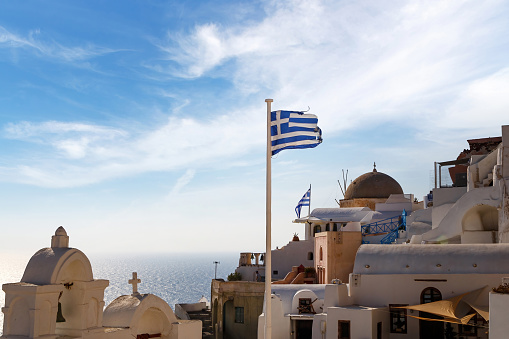Greece flag over old greek town