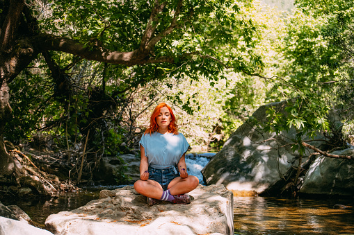 Redhead Woman Doing Yoga in Nature