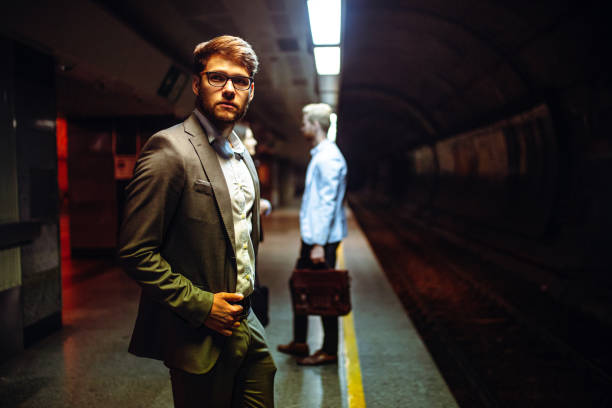 istock Business people waiting for metro in subway 1396646671