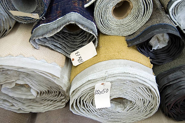 Carpet Rolls of carpet stacked on top of each other. theishkid stock pictures, royalty-free photos & images