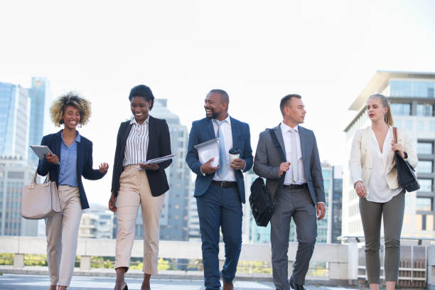istock Colleagues walking in the city on their way to work 1396647082