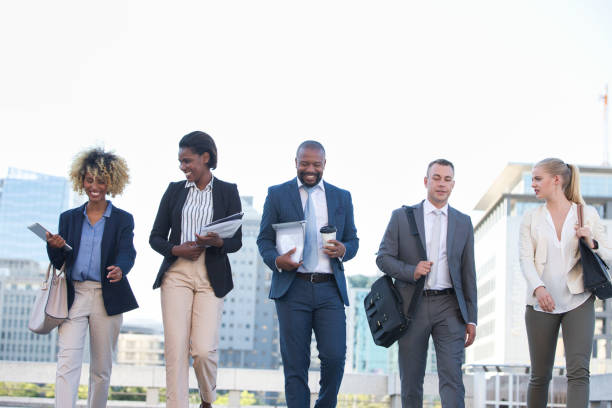 istock Colleagues walking in the city on their way to work 1396647094
