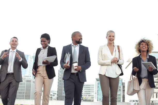 istock Colleagues walking in the city on their way to work 1396647121