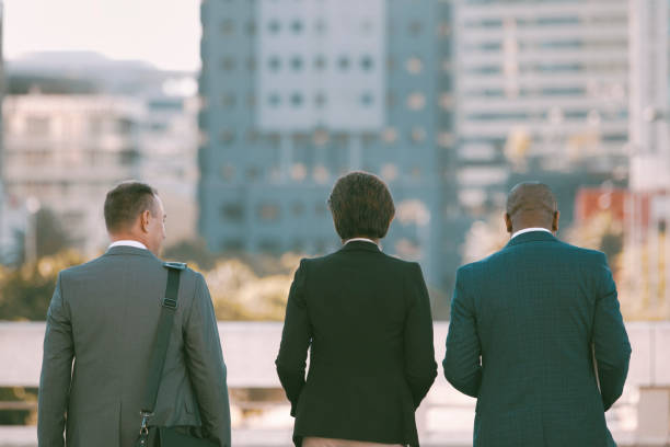 istock Back view of colleagues walking in the city 1396648284