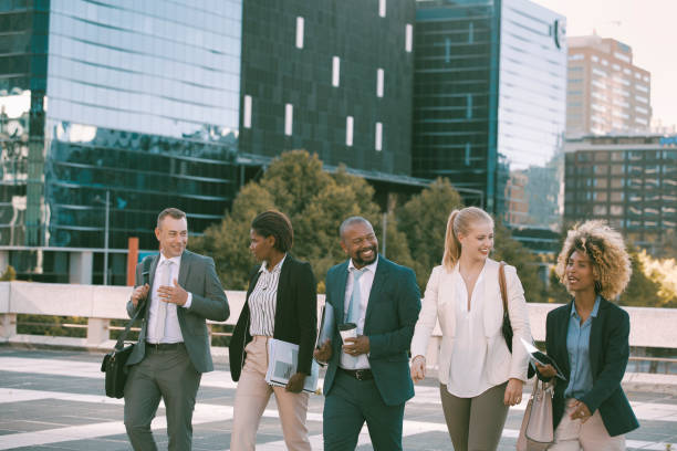 istock Colleagues walking in the city on their way to work 1396648287