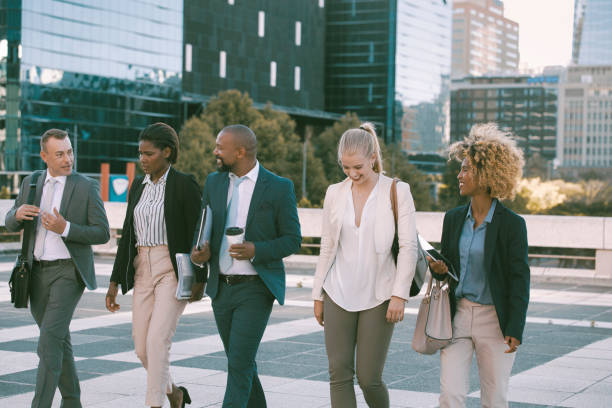 istock Colleagues walking in the city on their way to work 1396648418