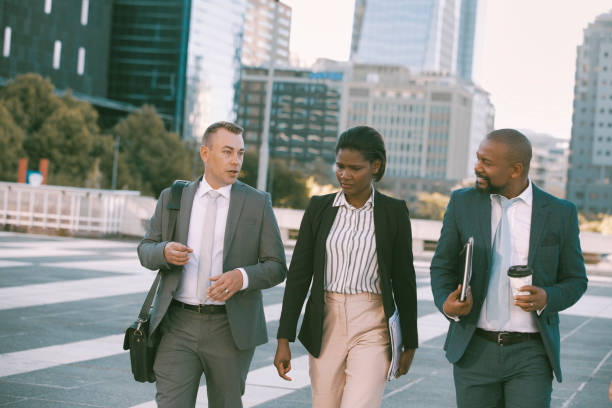 istock Colleagues walking in the city on their way to work 1396648420