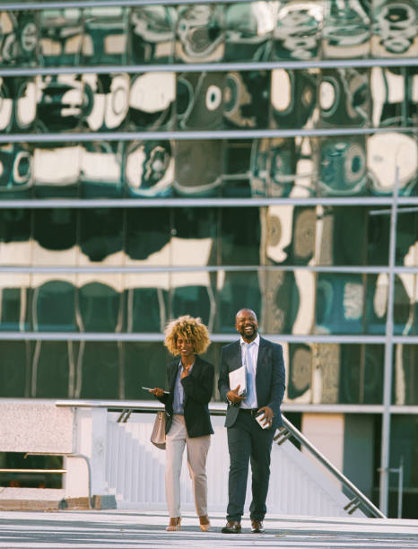 istock Colleagues walking in the city on their way to work 1396648448