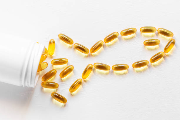 istock jar with omega 3 capsules in the shape of a fish on a white background 1396648462