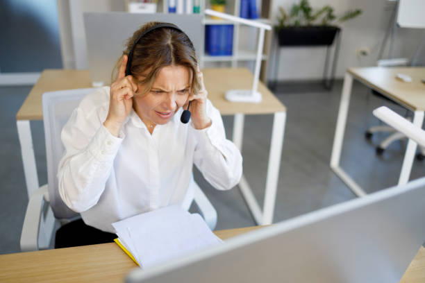 istock Female worker of call center has a problem with the client 1396651463