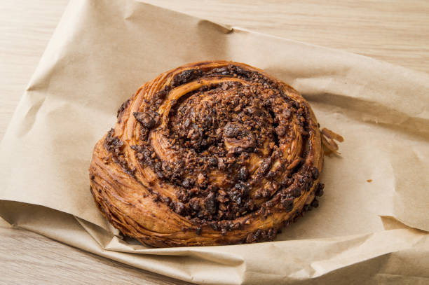 istock Sweet puff pastry bun with caramel 1396654097