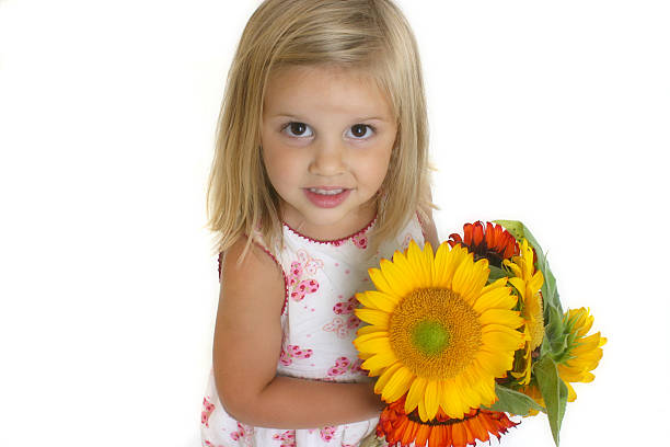 istock Cute Girl Holding Sunflower (6) 139665676