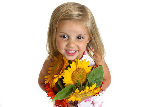 istock Cute Girl Holding Sunflower (5) 139665812