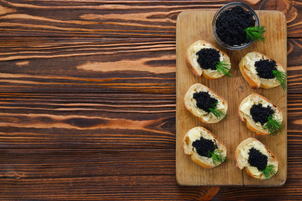 istock Toastes with black caviar. Spase for text or design. 1396658467